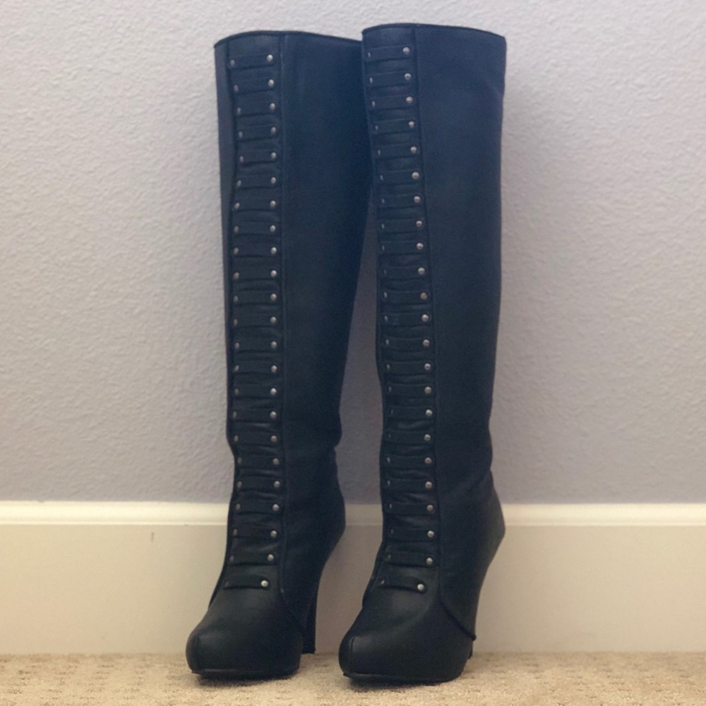 Black heeled knee high boots